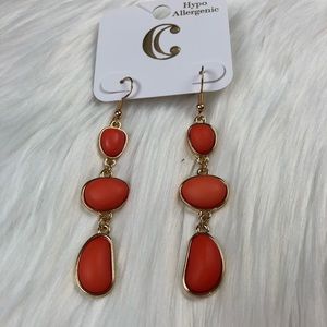 New fashion earrings. Dangle. Orange in color